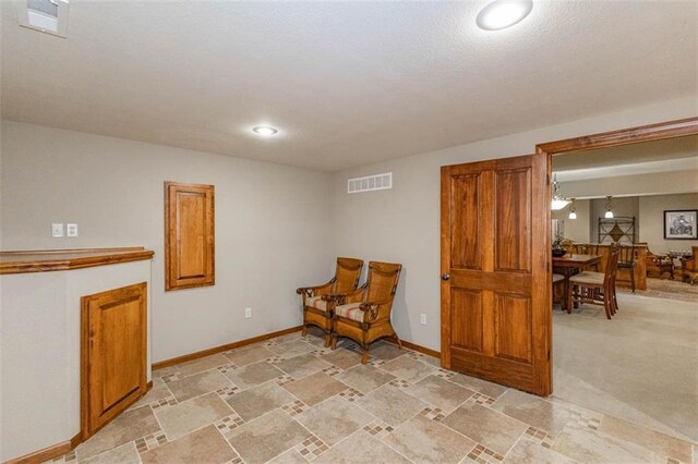 26650 W 100th Pl, Olathe, KS 66061 - living area with baseboards, recessed lighting, and light stone finish flooring