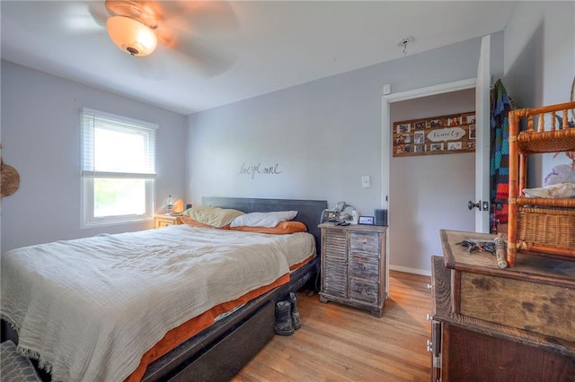 205 N 82nd Ter, Kansas City, KS 66112 - bedroom with light wood-type flooring, a ceiling fan, and baseboards