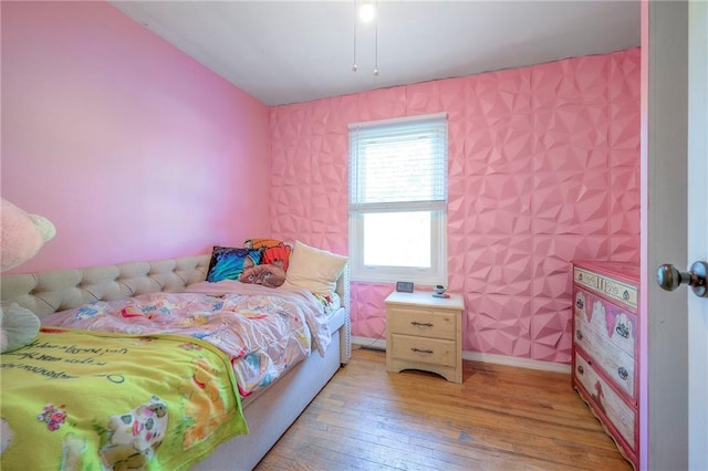 205 N 82nd Ter, Kansas City, KS 66112 - bedroom featuring light wood-style flooring, wallpapered walls, and baseboards