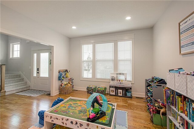 2241 Foxtail Dr, Kearney, MO 64060 - playroom featuring wood finished floors, baseboards, and recessed lighting