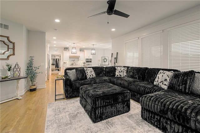 2241 Foxtail Dr, Kearney, MO 64060 - living area with light wood-style flooring, ceiling fan, recessed lighting, and baseboards