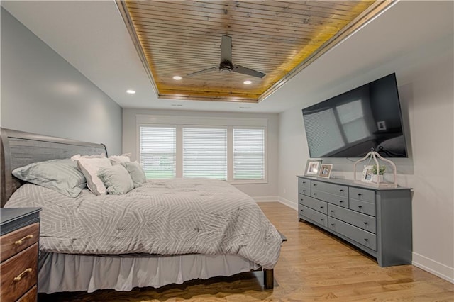 2241 Foxtail Dr, Kearney, MO 64060 - bedroom featuring a tray ceiling, baseboards, light wood-style floors, wooden ceiling, and recessed lighting
