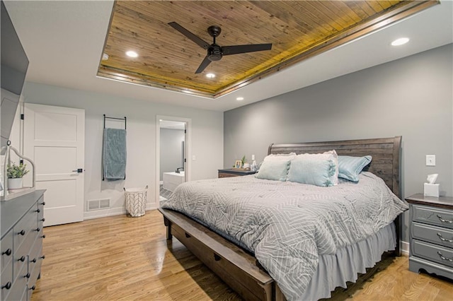 2241 Foxtail Dr, Kearney, MO 64060 - bedroom featuring a tray ceiling, wood ceiling, light wood-style floors, recessed lighting, and ensuite bath