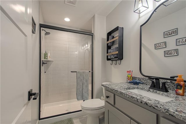 2241 Foxtail Dr, Kearney, MO 64060 - full bathroom featuring a shower stall, toilet, vanity, and recessed lighting