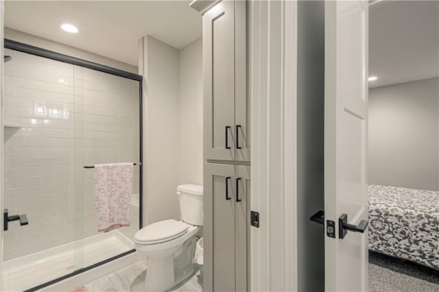 2241 Foxtail Dr, Kearney, MO 64060 - bathroom with a shower stall, toilet, and recessed lighting