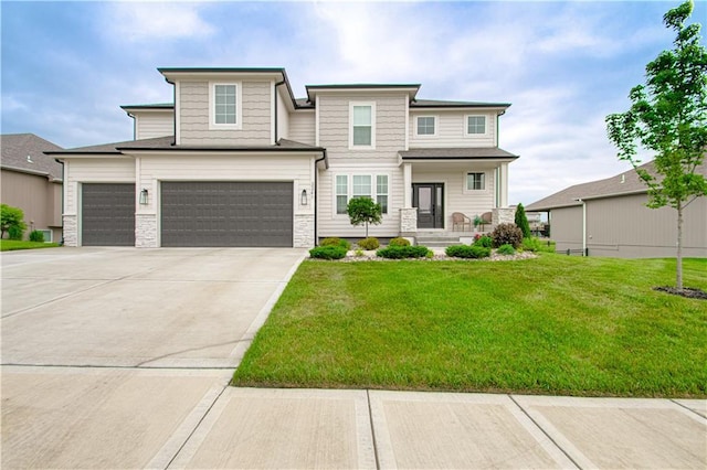 2241 Foxtail Dr, Kearney, MO 64060 - view of front of house featuring a front yard, a garage, stone siding, and concrete driveway