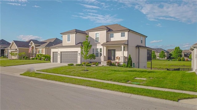 2241 Foxtail Dr, Kearney, MO 64060 - view of front of house featuring a residential view, concrete driveway, a front lawn, and a garage