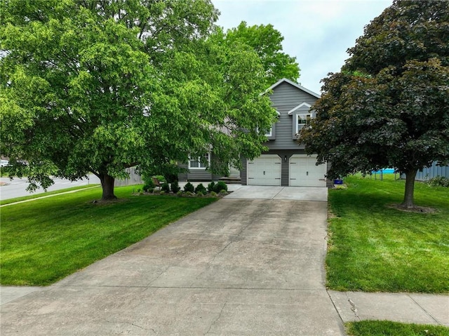 15642 W 146th Ter, Olathe, KS 66062 - view of property hidden behind natural elements featuring concrete driveway, an attached garage, and a front lawn