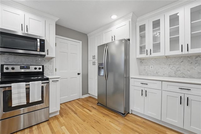 15642 W 146th Ter, Olathe, KS 66062 - kitchen with stainless steel appliances, light countertops, white cabinetry, light wood-style flooring, and recessed lighting