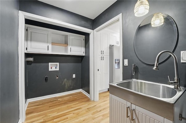 15642 W 146th Ter, Olathe, KS 66062 - kitchen featuring a sink, light wood-type flooring, white cabinetry, fridge with ice dispenser, and baseboards