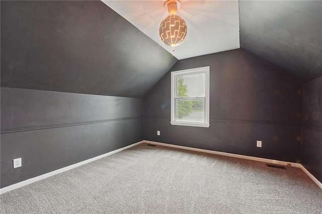 15642 W 146th Ter, Olathe, KS 66062 - additional living space with carpet floors, vaulted ceiling, and baseboards