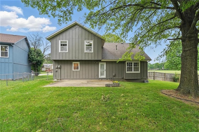 15642 W 146th Ter, Olathe, KS 66062 - rear view of house with board and batten siding, a patio area, and a shingled roof