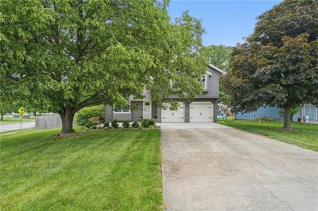 15642 W 146th Ter, Olathe, KS 66062 - view of property hidden behind natural elements with driveway, an attached garage, and a front lawn