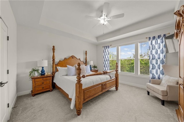 11573 S Mize Rd, Olathe, KS 66061 - bedroom with baseboards, a raised ceiling, light colored carpet, and a ceiling fan