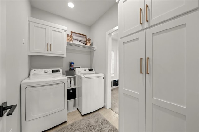 11573 S Mize Rd, Olathe, KS 66061 - laundry room with independent washer and dryer, cabinet space, light wood finished floors, and recessed lighting