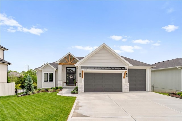 11573 S Mize Rd, Olathe, KS 66061 - view of front facade featuring a garage, driveway, a standing seam roof, brick siding, and metal roof