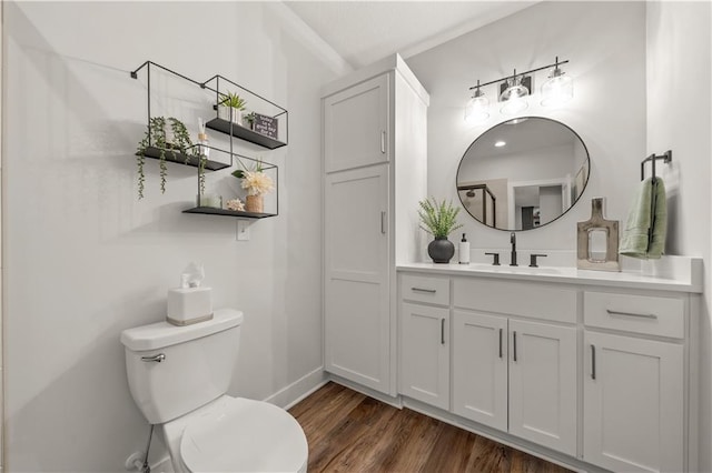 11573 S Mize Rd, Olathe, KS 66061 - bathroom with vanity, toilet, wood finished floors, and baseboards