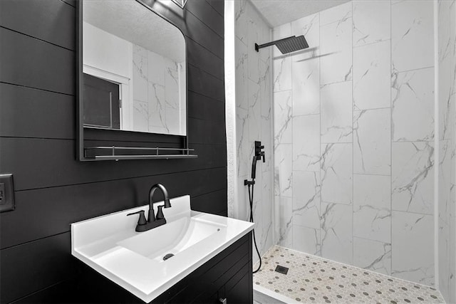 527 Cypress Ave, Kansas City, MO 64124 - bathroom featuring vanity and a marble finish shower