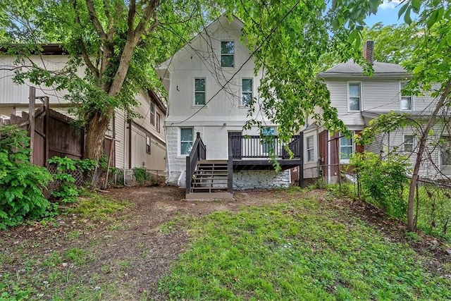 527 Cypress Ave, Kansas City, MO 64124 - back of property featuring a deck, stairway, and a chimney