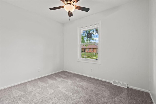 8003 E 118th Ter, Kansas City, MO 64134 - carpeted spare room featuring a ceiling fan and baseboards