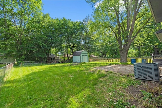 8003 E 118th Ter, Kansas City, MO 64134 - view of yard with a storage unit, central AC unit, an outbuilding, and a patio