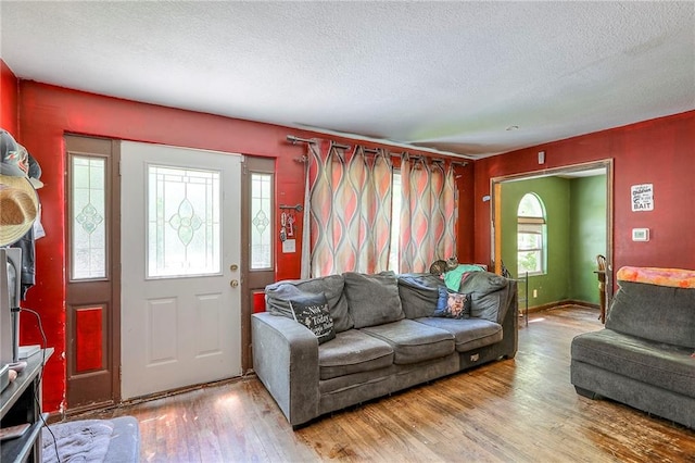 5316 NE 49th St, Kansas City, MO 64119 - living room with a textured ceiling and wood finished floors