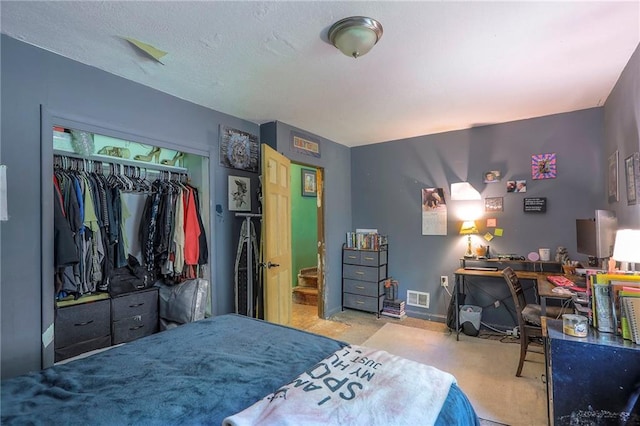 5316 NE 49th St, Kansas City, MO 64119 - carpeted bedroom featuring a closet and an office area