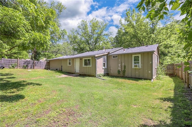 5316 NE 49th St, Kansas City, MO 64119 - back of property featuring board and batten siding and a fenced backyard