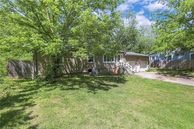 5316 NE 49th St, Kansas City, MO 64119 - view of property hidden behind natural elements with dirt driveway