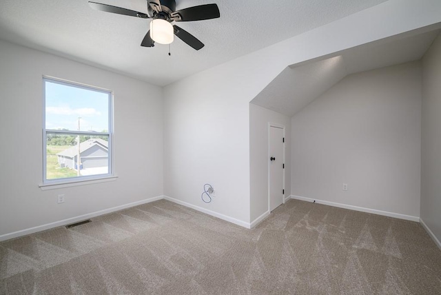 1012 2nd St, Perry, KS 66073 - additional living space with carpet flooring, a ceiling fan, baseboards, and vaulted ceiling