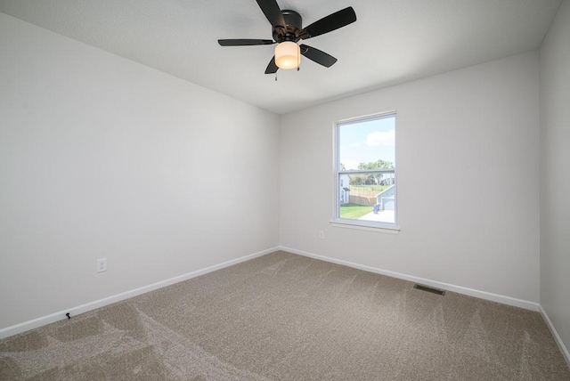 1012 2nd St, Perry, KS 66073 - spare room featuring carpet flooring, baseboards, and ceiling fan
