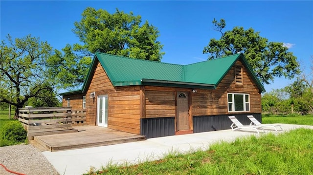 13106 Quinn Rd, Pleasanton, KS 66075 - view of side of home featuring a deck and metal roof