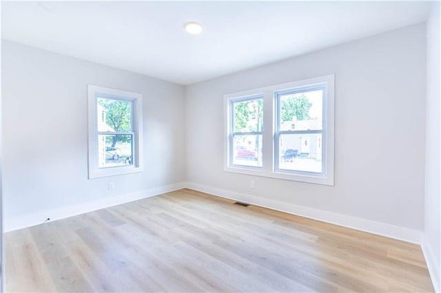 3312 Delavan Ave, Kansas City, KS 66104 - spare room featuring baseboards and light wood-type flooring