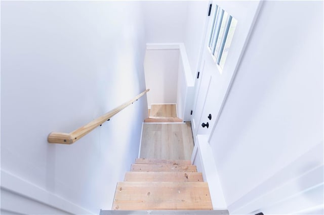 3312 Delavan Ave, Kansas City, KS 66104 - stairs featuring wood finished floors