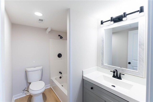 3312 Delavan Ave, Kansas City, KS 66104 - full bathroom featuring toilet, vanity, bathtub / shower combination, wood finished floors, and baseboards