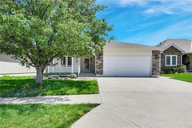 4641 SW Soldier Dr, Lees Summit, MO 64082 - view of front of home featuring an attached garage, driveway, stone siding, and a front lawn