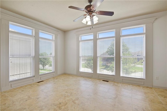 4641 SW Soldier Dr, Lees Summit, MO 64082 - empty room with healthy amount of natural light, ceiling fan, and light tile patterned flooring