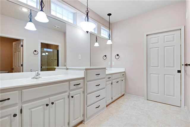 4641 SW Soldier Dr, Lees Summit, MO 64082 - full bathroom with a shower stall, vanity, and baseboards