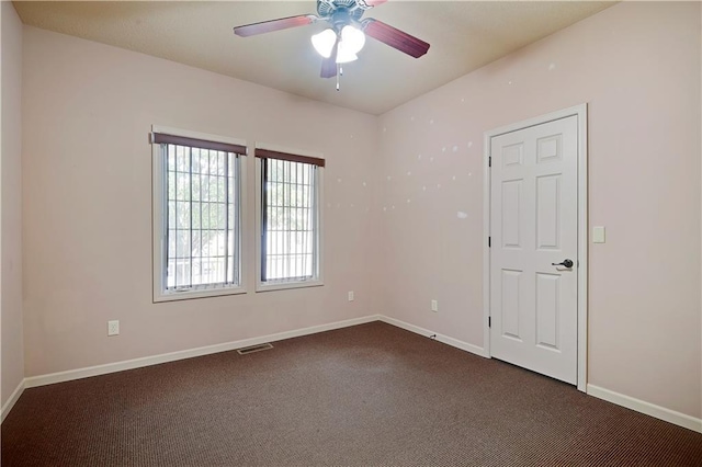 4641 SW Soldier Dr, Lees Summit, MO 64082 - spare room with dark carpet, baseboards, and ceiling fan