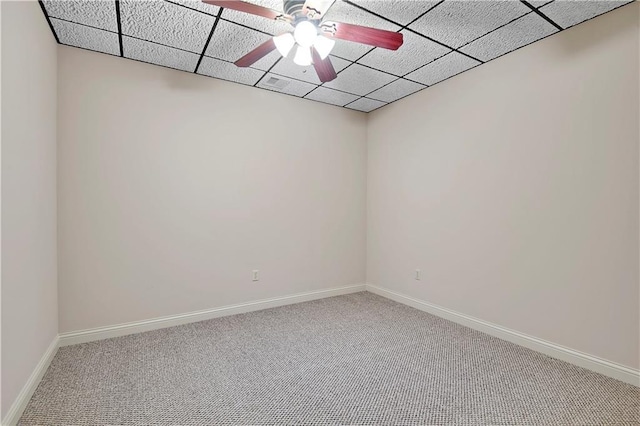 4641 SW Soldier Dr, Lees Summit, MO 64082 - empty room with carpet floors, baseboards, a ceiling fan, and a paneled ceiling