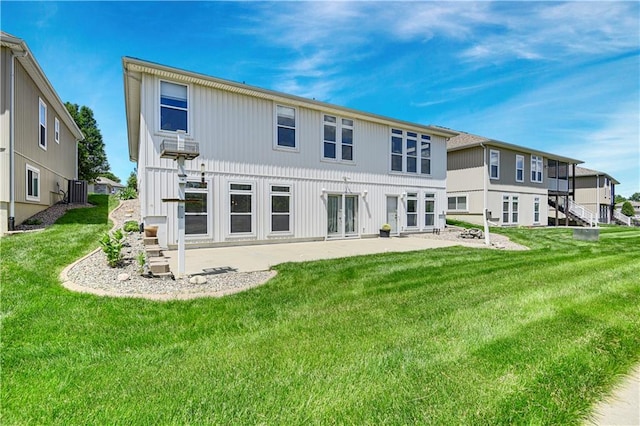 4641 SW Soldier Dr, Lees Summit, MO 64082 - rear view of house with a patio and a yard