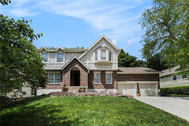 5208 NW 58th Ter, Kansas City, MO 64151 - tudor-style house featuring a front yard, driveway, a garage, and brick siding