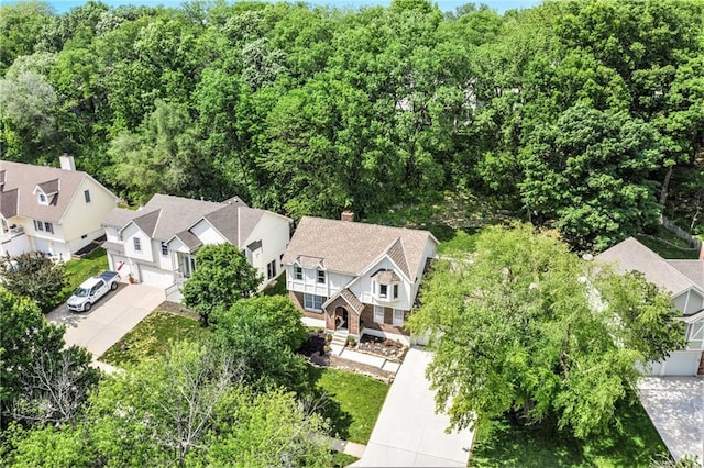 5208 NW 58th Ter, Kansas City, MO 64151 - aerial perspective of suburban area featuring a heavily wooded area