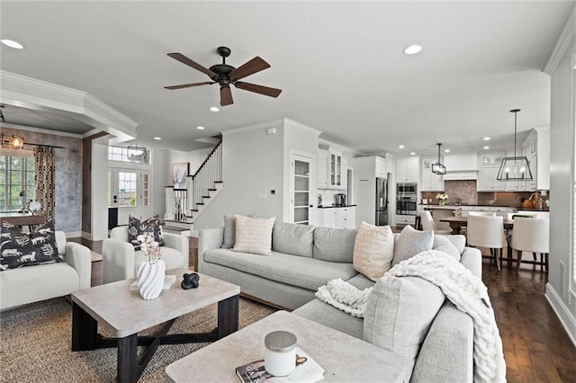 24957 W 98th St, Lenexa, KS 66227 - living area with recessed lighting, crown molding, a ceiling fan, dark wood-style flooring, and stairway