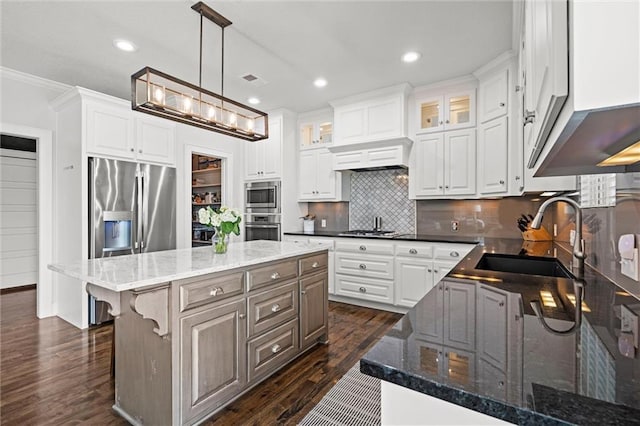 24957 W 98th St, Lenexa, KS 66227 - kitchen with appliances with stainless steel finishes, a sink, dark wood-style flooring, white cabinets, and crown molding