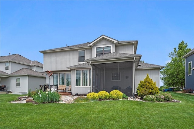 24957 W 98th St, Lenexa, KS 66227 - back of property featuring a sunroom, a yard, roof with shingles, and a patio area