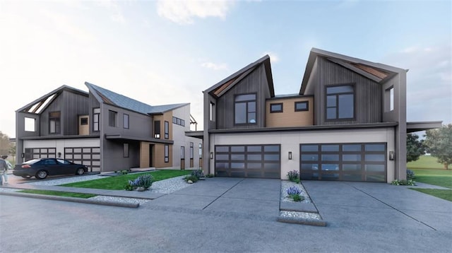 22504 W 93rd Ter, Lenexa, KS 66227 - contemporary house with driveway, an attached garage, and board and batten siding