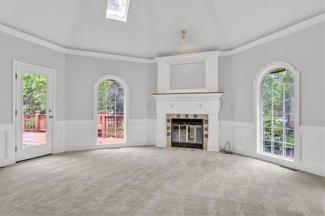1600 NE 97th St, Kansas City, MO 64155 - unfurnished living room featuring carpet flooring, wainscoting, a fireplace with flush hearth, crown molding, and plenty of natural light