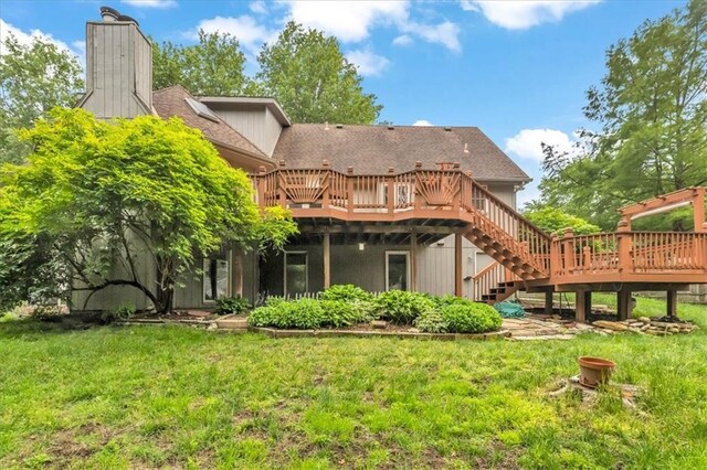 1600 NE 97th St, Kansas City, MO 64155 - back of property with a deck, stairway, a lawn, and a chimney