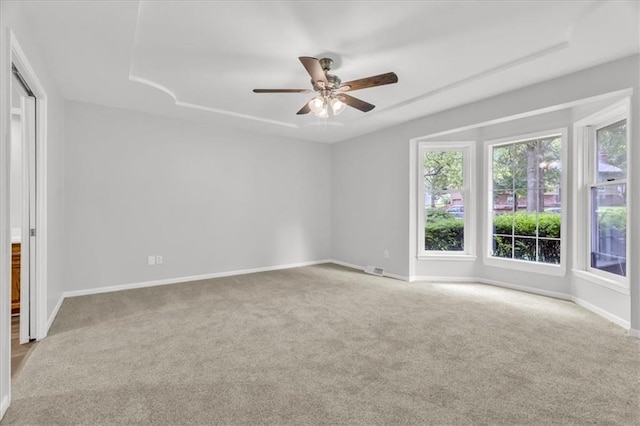 1600 NE 97th St, Kansas City, MO 64155 - carpeted spare room featuring healthy amount of natural light, baseboards, and a ceiling fan